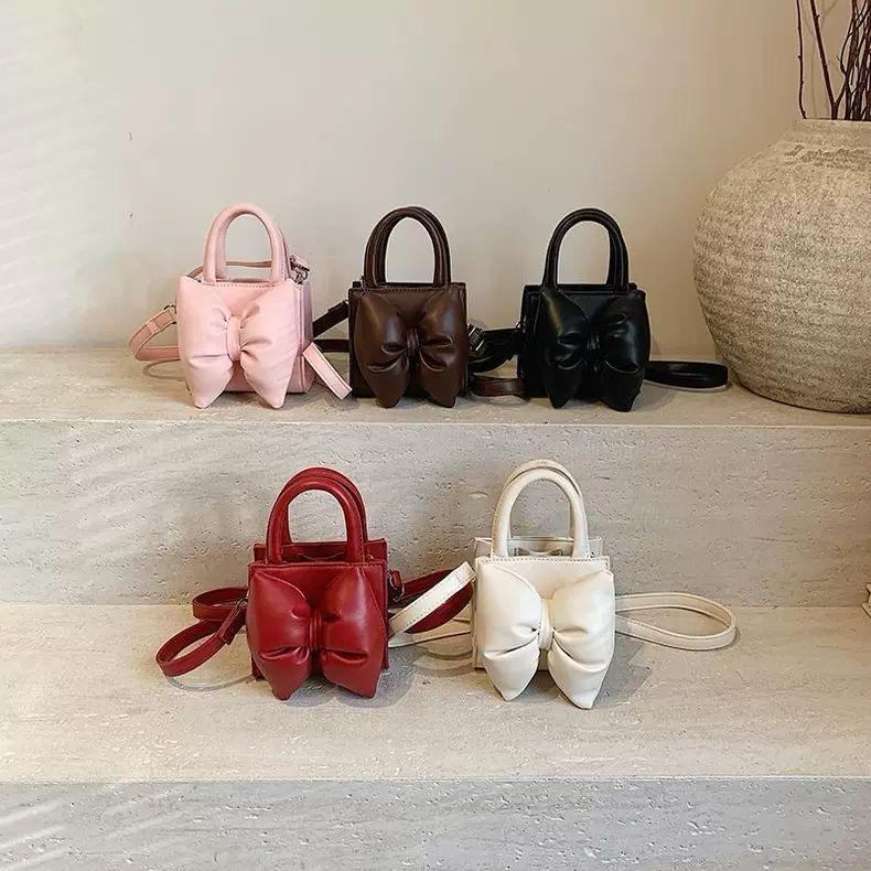 The bow mini purse